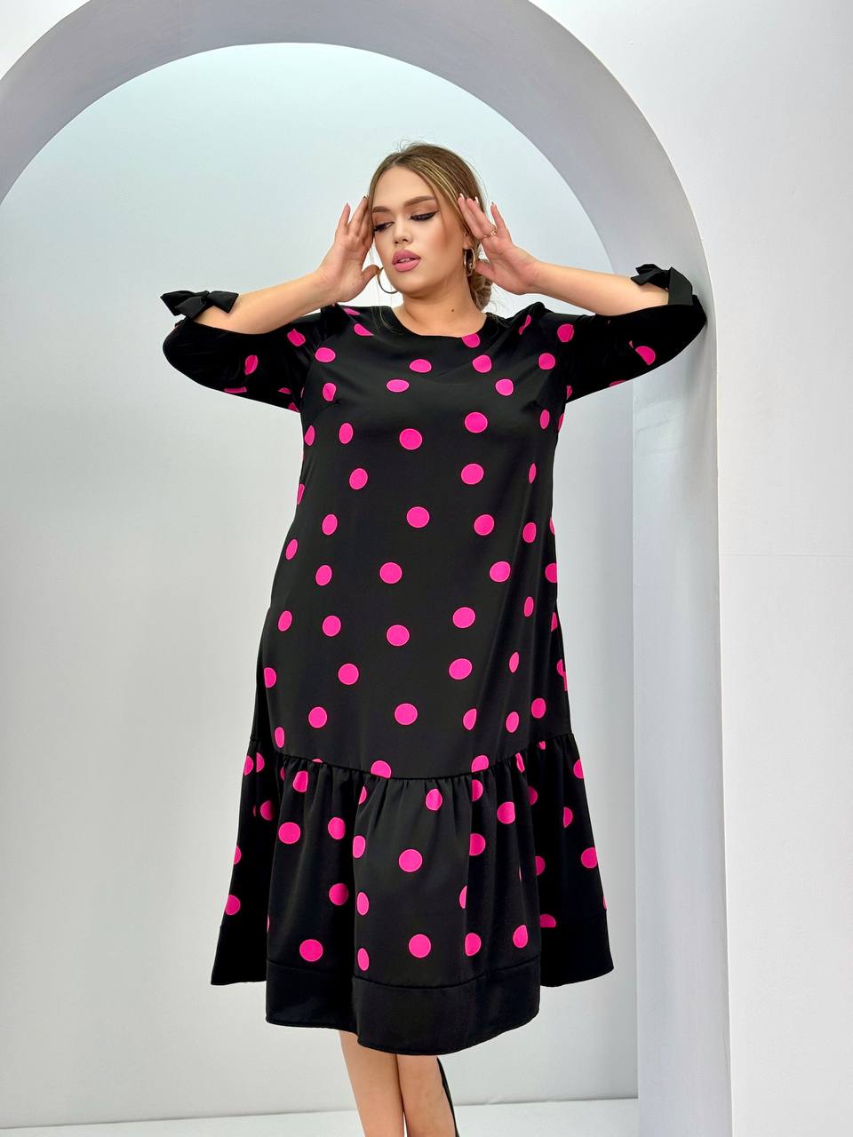 Women's bright polka dot mid-length dress - a versatile and comfortable style